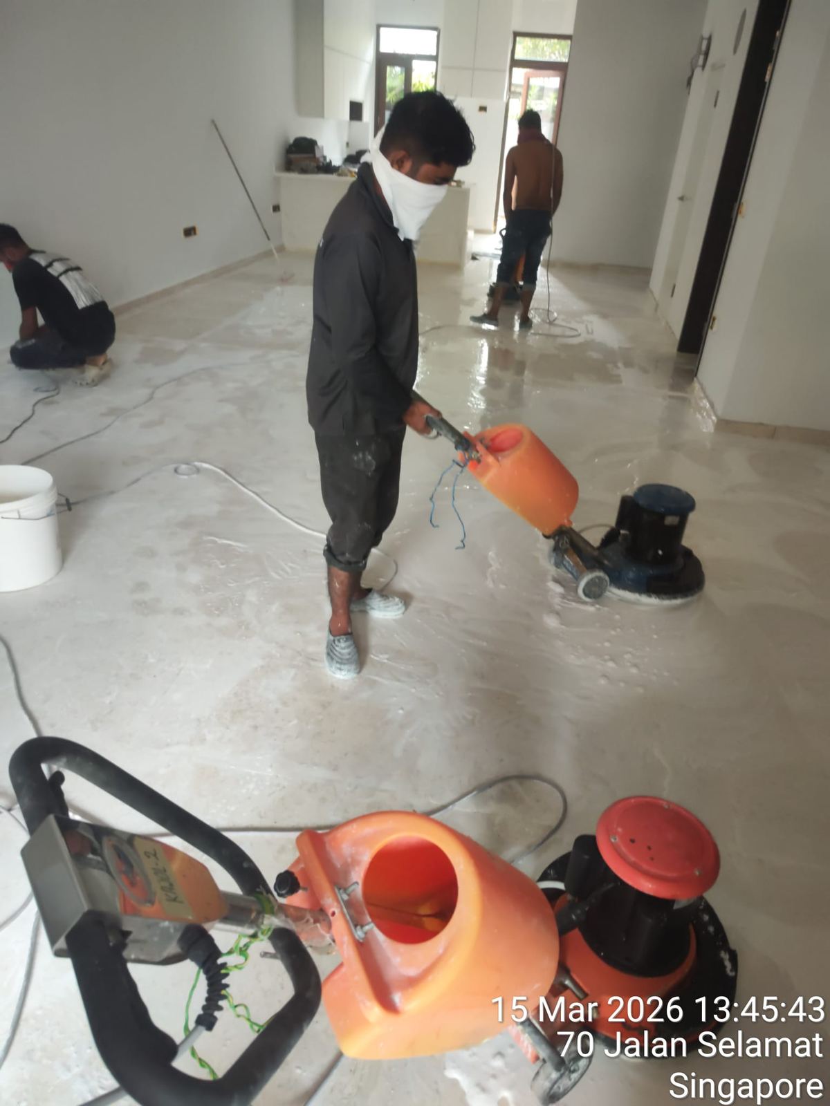 Real photo: our team grinding a marble floor on-site at Jalan Selamat, Singapore